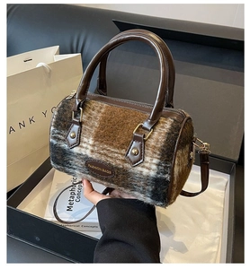 Detail of Boston-style plaid wool handbag in a gift box with synthetic leather handles