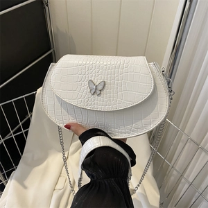 White mini saddle bag with crocodile pattern, butterfly buckle and silver chain strap