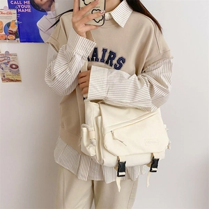 Harajuku retro canvas messenger bag in cream white with adjustable buckle closures