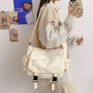 Japanese style cream canvas messenger bag with double buckles and large capacity