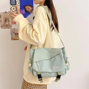 Large capacity sage green canvas messenger bag with flip cover for women in casual style