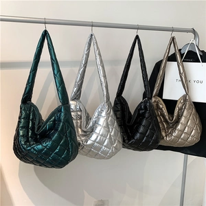 Quilted tote bags in metallic colors including silver black and gold with large diamond stitching
