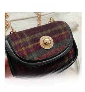 Detailed close-up of vintage purple plaid tweed mini bag with gold chain strap