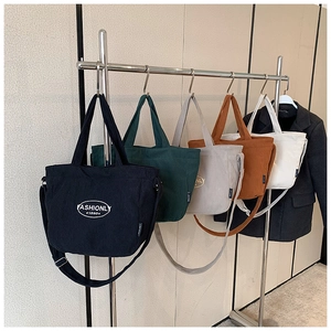 Corduroy tote bags in five colors with FASHIONLY 1980 logo and adjustable straps