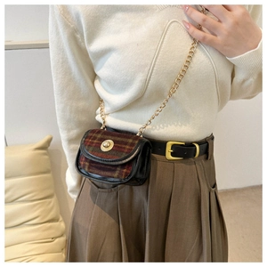 Detail of vintage red and yellow plaid tweed mini bag with gold chain strap