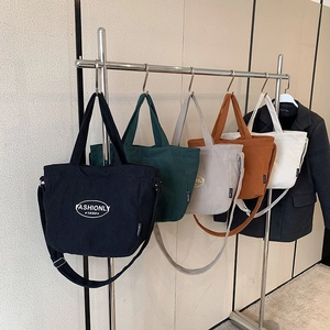 Casual corduroy tote bags in multiple colors with top handles and adjustable straps