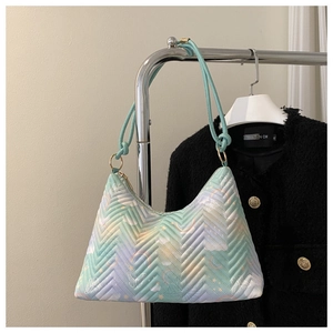 Detail of macaron gradient underarm bag with V-quilted texture and cloud rainbow patterns