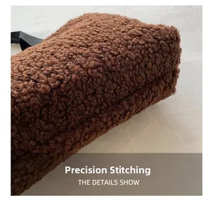 Macro detail of precision stitching and thick teddy plush fabric on the bucket bag bottom