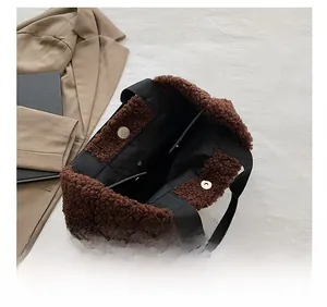Detail view of brown teddy fleece tote bag interior with zipper pocket and magnetic snap