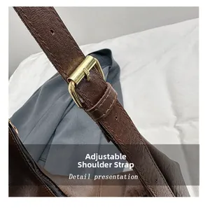 Detailed close-up of dark brown leather adjustable strap with premium gold metal buckle