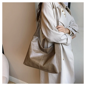 Detail view of khaki PU leather hobo bag showing adjustable strap and stitching