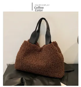 Detail view of coffee brown plush fleece bucket bag with black sturdy strap handles