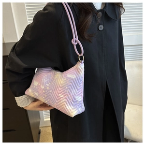 Close-up of pink-purple gradient fabric shoulder bag with V-shaped quilting and star prints
