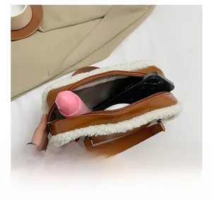 Internal view of fashion crossbody bag with plush fur trim showing spacious capacity