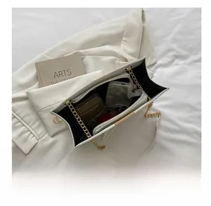 Internal view showing large capacity and compartments of the white PU leather tote bag