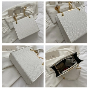 Detailed views of white crocodile pattern tote bag with gold chain and interior storage