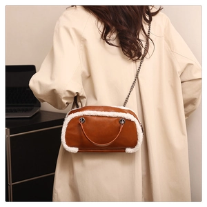 Brown faux leather crossbody bag with white faux fur trim and chain strap details