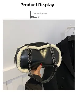 Detail of black glossy faux leather bag with white faux fur trim and silver metal chain