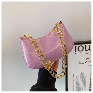 Sparkly purple baguette bag with chunky gold chain strap and shimmering glitter finish
