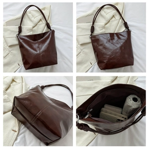 Detailed views of dark brown leather tote bag with knot handle and spacious interior