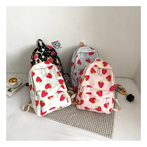 Detailed grid of four strawberry and daisy pattern backpacks in various soft colors