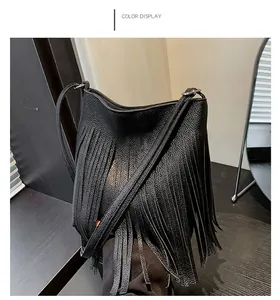 Close-up of black litchi grain leather bucket bag with dense hanging tassels