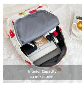 Detailed interior of strawberry school backpack showing large capacity and compartments