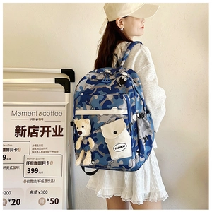 Blue camouflage school backpack with bear plush charm and side mesh water bottle pocket