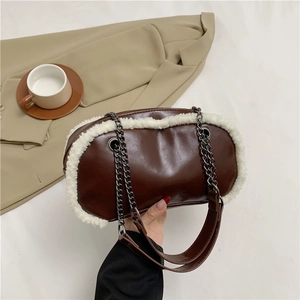 Brown leather shoulder bag with white faux fur trim and elegant dark metal chain strap