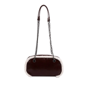 Brown leather shoulder bag with white faux fur trim and metallic chain strap