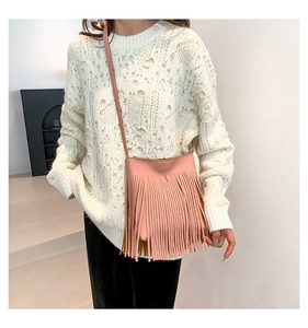 Pink leather fringe crossbody bag for women with tassel detail and minimalist design