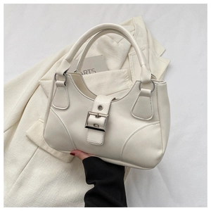 Detail of a creamy white half-moon handbag featuring a silver buckle and smooth PU leather