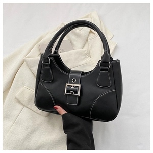 Close-up of black retro handbag featuring white contrast stitching and silver metal buckle