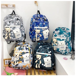 Detailed set of multi-color camouflage school backpacks with cute plush bear pendants