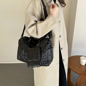 Quilted puffer tote bag in black with matching small coin pouch and nylon strap