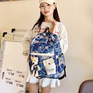 Blue camouflage high-capacity student backpack with teddy bear charm and multi-pockets