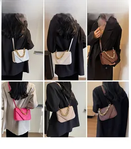 Detailed views of crossbody bags featuring stone pattern texture and chunky gold chains