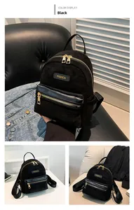 Détails du mélange de textures suède noir mat et cuir PU sur un mini sac à dos compact