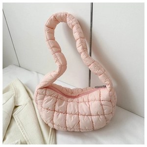 Close-up of pink quilted puffer hobo bag showing soft nylon texture and puffy strap detail