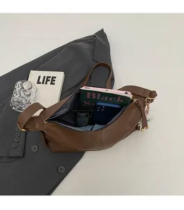 Top view of large capacity dark brown hobo bag showing spacious interior with personal items
