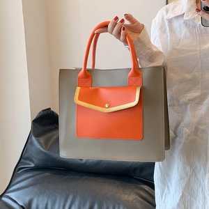 Minimalist grey and orange leather tote bag with stylish stitching and large capacity