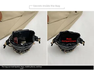 Internal view of black quilted mini bucket bag showing phone and essentials capacity