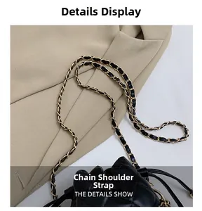 Detailed close-up of the woven metal and black leather chain strap on a quilted bag