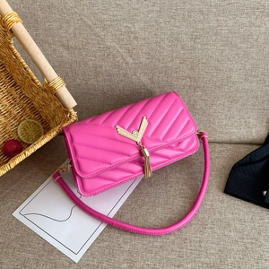 Magenta V-quilted faux leather shoulder bag with gold metal logo and fringe tassel charm