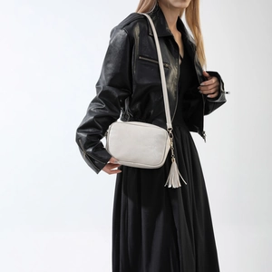 Retro cream white crossbody camera bag with elegant tassel and adjustable shoulder strap