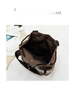 Detail view of the large capacity canvas bucket bag interior with zipper pocket and magnetic closure