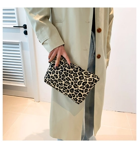 Fashionable leopard print clutch bag shown as a stylish accessory with autumn outfit