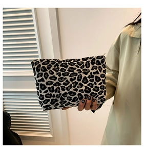 Detail of black and white leopard pattern handbag in high-quality textured jacquard fabric
