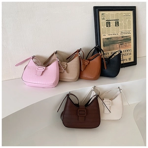 Detailed view of six hobo bags featuring crocodile pattern textures and curved openings