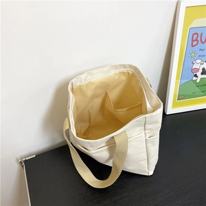 Sac cabas minimaliste en toile blanc crème avec doublure jaune et grande capacité pour les cours